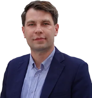 A bird sitting on a nest of eggs.